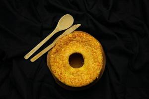 Cheese chiffon cake on black background photo