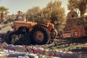 old vintage tractor on the farm photo