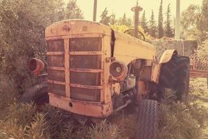 old vintage tractor on the farm photo