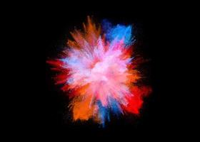 Colorful powder explosion, isolated on black background photo