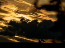 Beautiful summer day storm cloud with sun shining photo