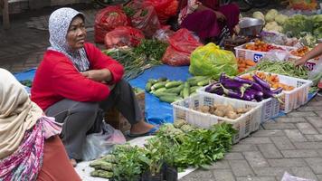 Ponorogo, Jawa Timur, Indonesia- 01-02-2020 People who are transacting in traditional markets with a variety of merchandise. Local products and imported products are the products of choice for buyers photo