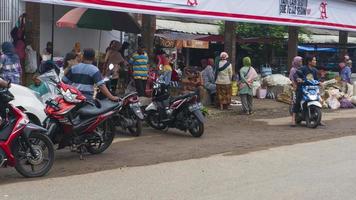 Ponorogo, Jawa Timur, Indonesia- 01-02-2020 People who are transacting in traditional markets with a variety of merchandise. Local products and imported products are the products of choice for buyers photo