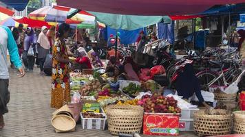Ponorogo, Jawa Timur, Indonesia- 01-02-2020  People who are transacting in traditional markets with a variety of merchandise. Local products and imported products are the products of choice for buyers photo