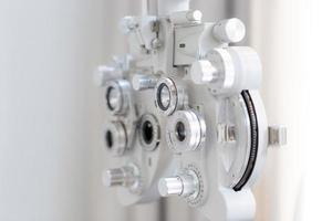 Selective focus of phoropter eyesight measurement testing machine in optical shop photo