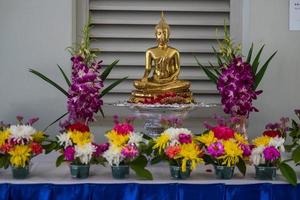 Buddha statue and flower garlands for Buddha bathing ceremony on important religious days for Buddhists.