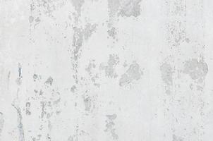 white white background and texture of peeling paint on plaster wall because  old paint expired. photo