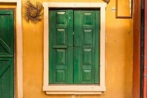 green Wood window on wall photo