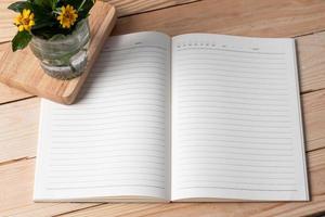 Note book on a wooden background. Copy space photo