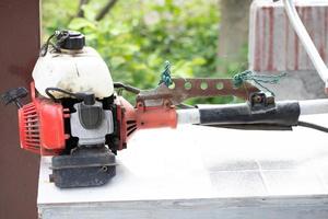 Old petrol lawn mower for carrying. photo