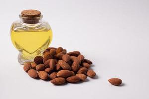 Almond oil on a wooden background photo