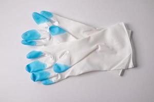 White blue rubber gloves on a white background photo