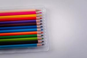 12 colored pencils on a white background photo