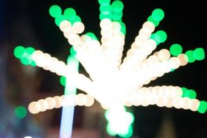 Blurred light with bokeh background of temple fair in Thailand.Abstract blurred circular bokeh background. photo