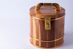 Wooden savings bank with a key lock on the front photo