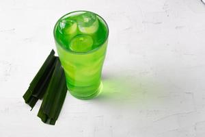Pandan juice in ice on a green background photo