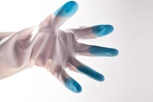 White blue rubber gloves on a white background photo