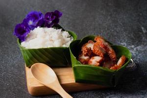 Pork fried rice in banana leaf krathong photo