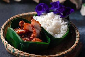 Pork fried rice in banana leaf krathong photo