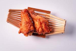 Close up. Deep fried chicken leg on a white background. photo