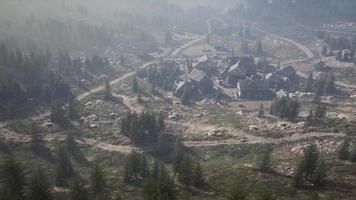 Old wooden village on the rocky mountain background video