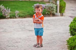 Funny boy at garden of egyptian resort. photo