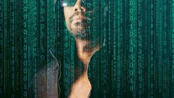 The concept of hackers and insecurity in networking. Dishonest hood man or data thieves photo