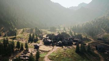 Old wooden village on the rocky mountain background video