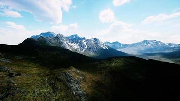 Aerial Over Valley With Snow Capped Mountains In Distance video