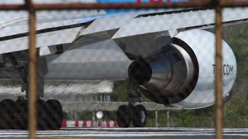 Airliner standing on a runway start before departure, close up. video