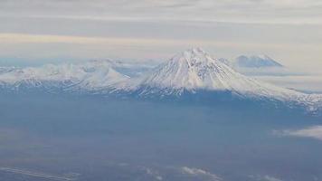 Aerial view of the mountain landscape with volcanoes of Kamchatka video