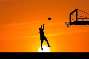 basketball player silhouette jumping photo