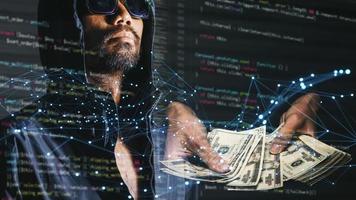 The concept of hackers and insecurity in networking. Dishonest hood man or data thieves photo