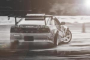 Lens blur of car racing. car race background concept photo