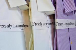 Freshly laundered dress shirts folded ready for key clients photo