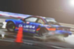 Lens blur of car racing. car race background concept photo