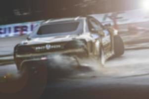 Lens blur of car racing. car race background concept photo