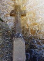 Cross at the entrance to the castle of Carcassonne, France photo