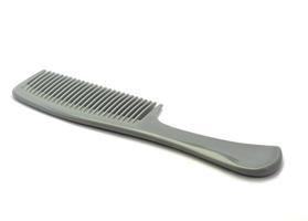 plastic comb on white photo