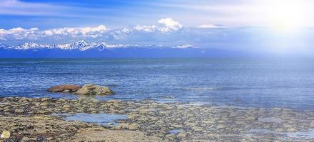 shore of the Pacific Ocean at low tide and in soft diffused sun light photo