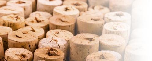 Background pattern of wine bottles corks in soft diffused light. Selective focus photo