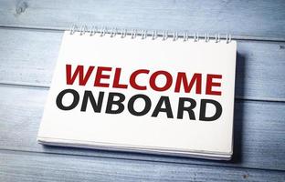 Welcome onboard and support symbol. Concept words Welcome onboard on white note photo