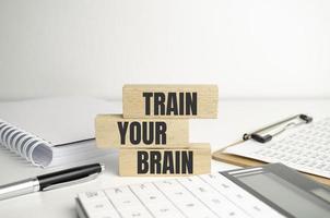 Train your brain on wooden block and calculator photo