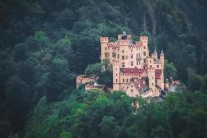 Top view Castle Hohenschwangau in Germany. The Royal Palace in Bavaria. The yellow famous palace is a tourist attraction. photo