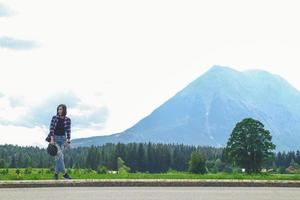 Asian women tourists and backpackers waiting car., Tourist woman waiting for car on road outdoor. photo