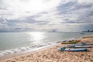 Surfboards laid by the sea, Pattaya Beach, in afternoo photo