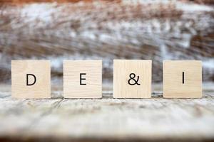 DEI, Diversity, equity, inclusion symbol. Wooden blocks with words DEI concept photo
