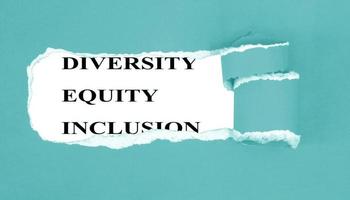 Diversity, equity, inclusion appearing behind torn paper background , DEI concept photo