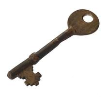 Old ancient key isolated on white background photo