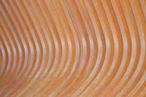 Wooden bench element, brown slats with a rounded edge. Abstract background. photo